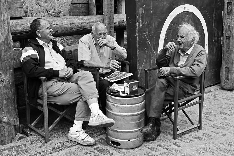 grayscale photography of three men sitting on chair while talking to each other, HD wallpaper