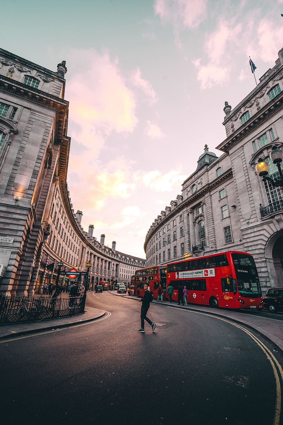 London S Curve, man crossing asphalt road, building, architecture