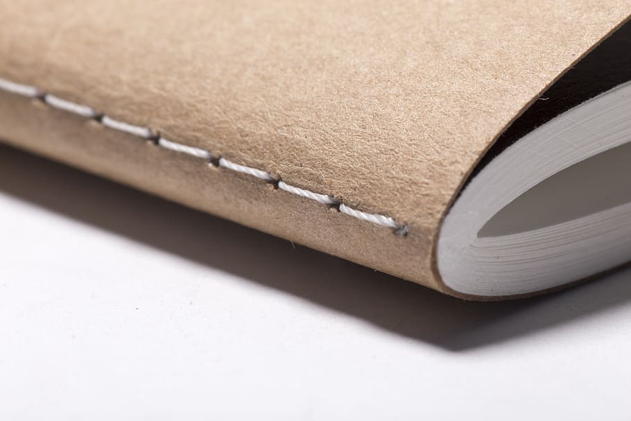 closeup photo of brown softbound book, binding, corner, education HD wallpaper