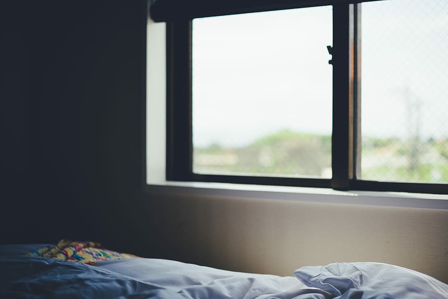 white wall, blue bedspread near brown framed glass window closed HD wallpaper