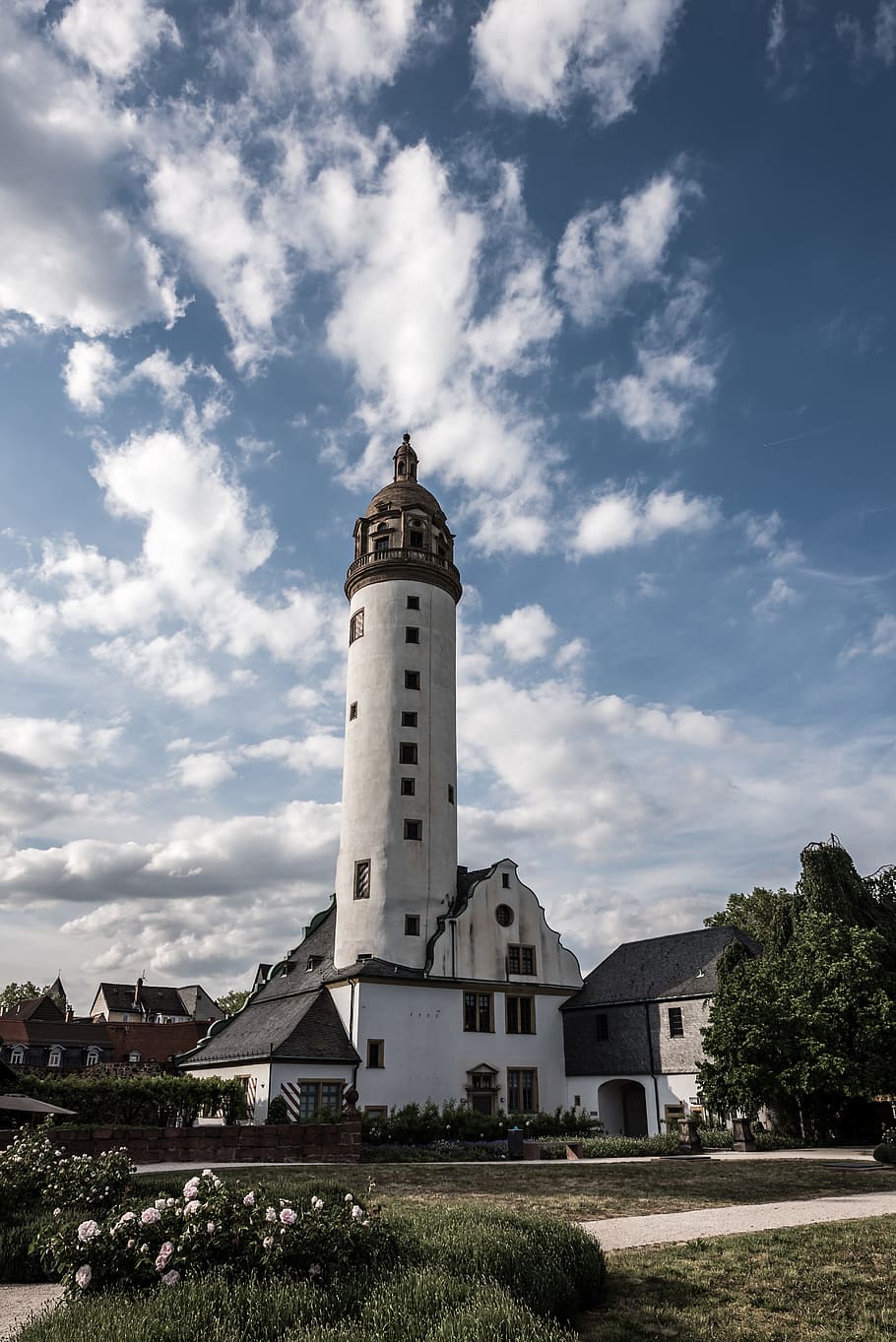 white and brown cathedral under blue and white skies, lighthouse surrounded by houses under cloudy sky HD wallpaper