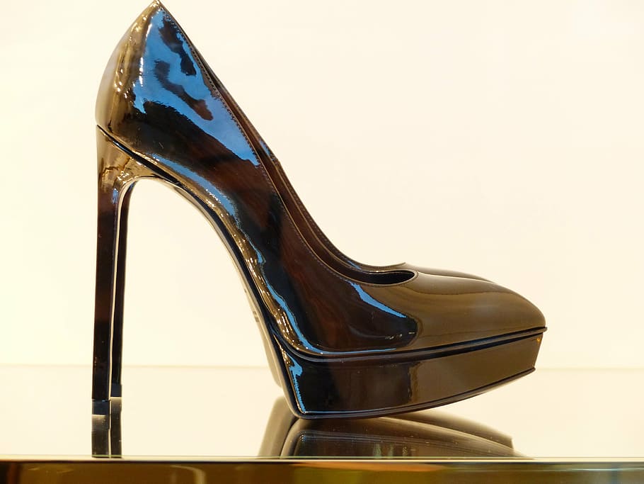 close-up photography of black patent leather pump, shoe, high heeled shoe