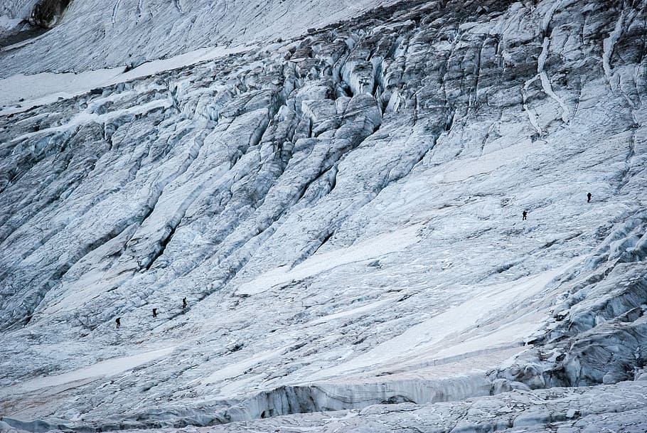 people walking on mountain during snow, gray mountain covered by snow HD wallpaper