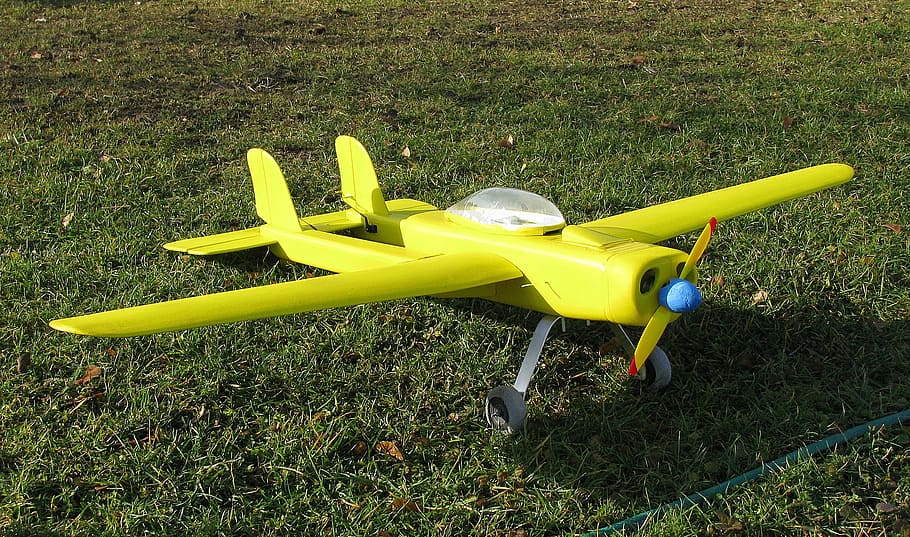 model airplane, yellow, model flight, hobby, grass, nature HD wallpaper