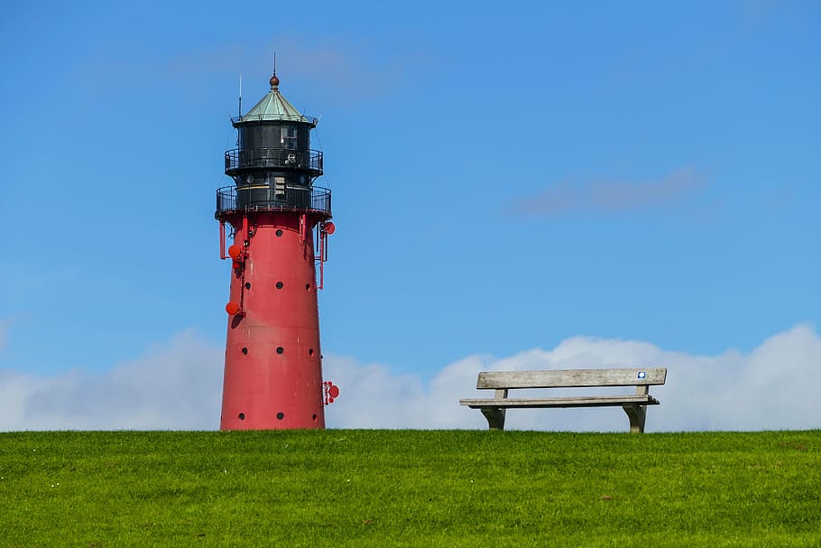 red and black lighthouse near on gray bench on grass field, north sea, HD wallpaper