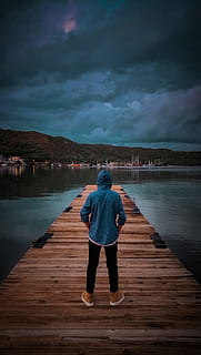 Man Wearing Blue Hoodie Standing On Wooden Dock, alone, cloudy HD wallpaper