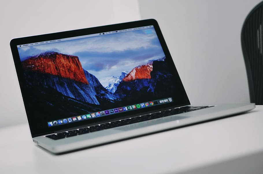 turned on MacBook, MacBook Pro, laptop, screen, mountain, office HD wallpaper