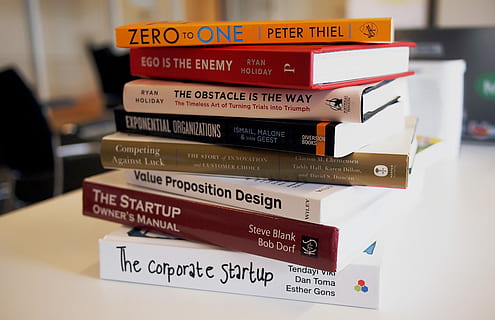 pile of assorted-title books, assorted books macro photography HD wallpaper