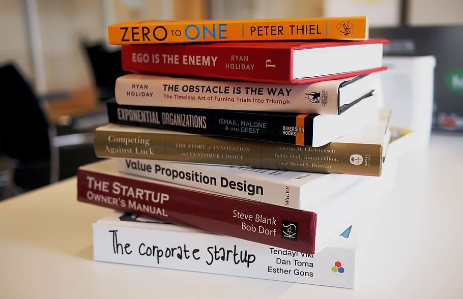 pile of assorted-title books, assorted books macro photography HD wallpaper