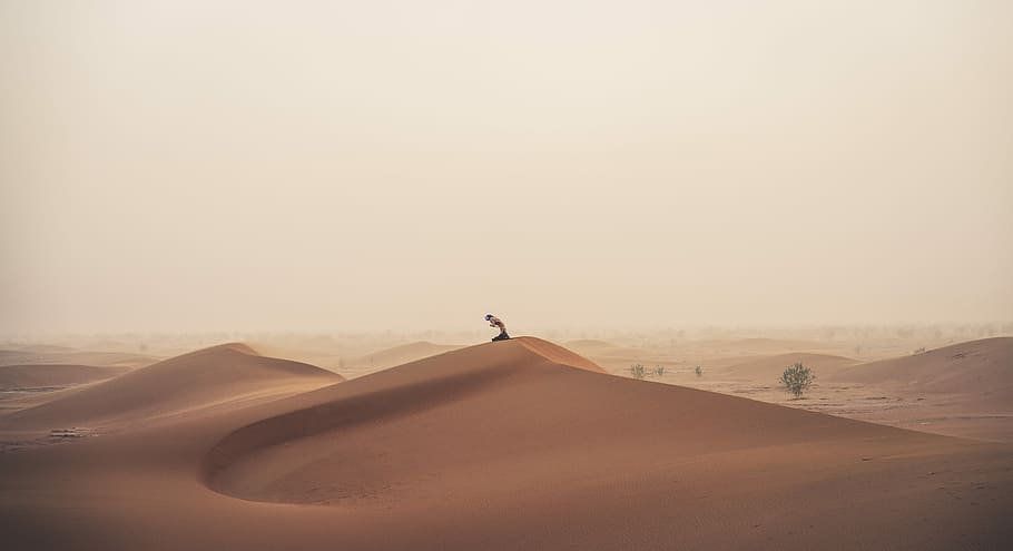 person standing on hill dessert, sand, yoga, prayer, faith, desert