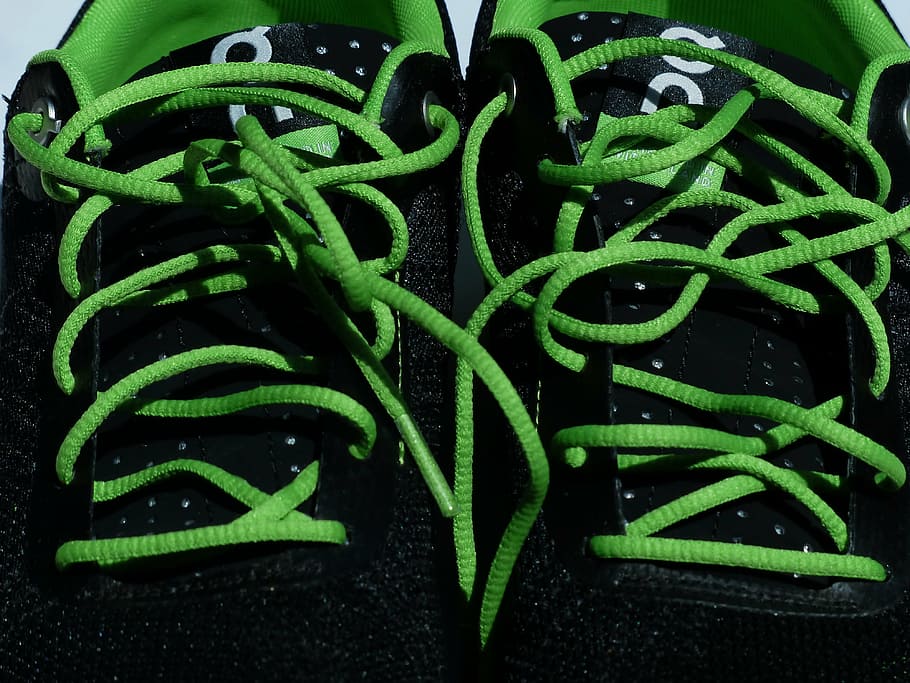 pair of black-and-grey sneakers, shoelaces, lacing, green, sports shoes