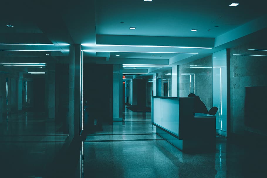 white wooden desk on hallway inside building, turned on lights in building hall HD wallpaper
