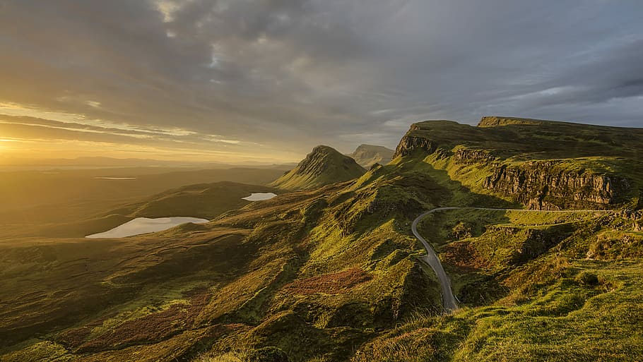 bird's eye photography of winding road on mountain, aerial view of green mountain under cloudy sky HD wallpaper