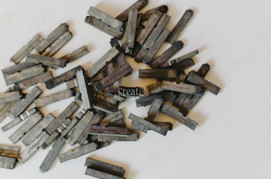 closeup photo of clothespin lot on white surface, Printing Press Letters HD wallpaper