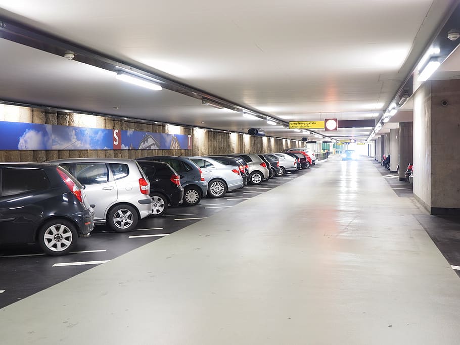 assorted-color vehicle parked on parking lot, multi storey car park