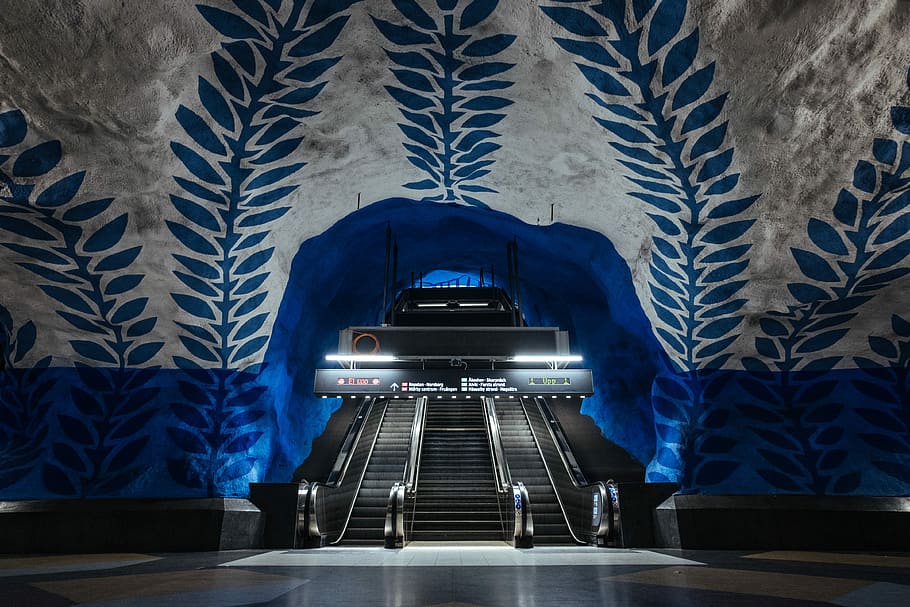 blue and white foliage building interior with escalator, turned on ladder light HD wallpaper