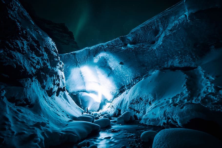 person beside cliff, ice, cave, rocks, snow, winter, lights HD wallpaper
