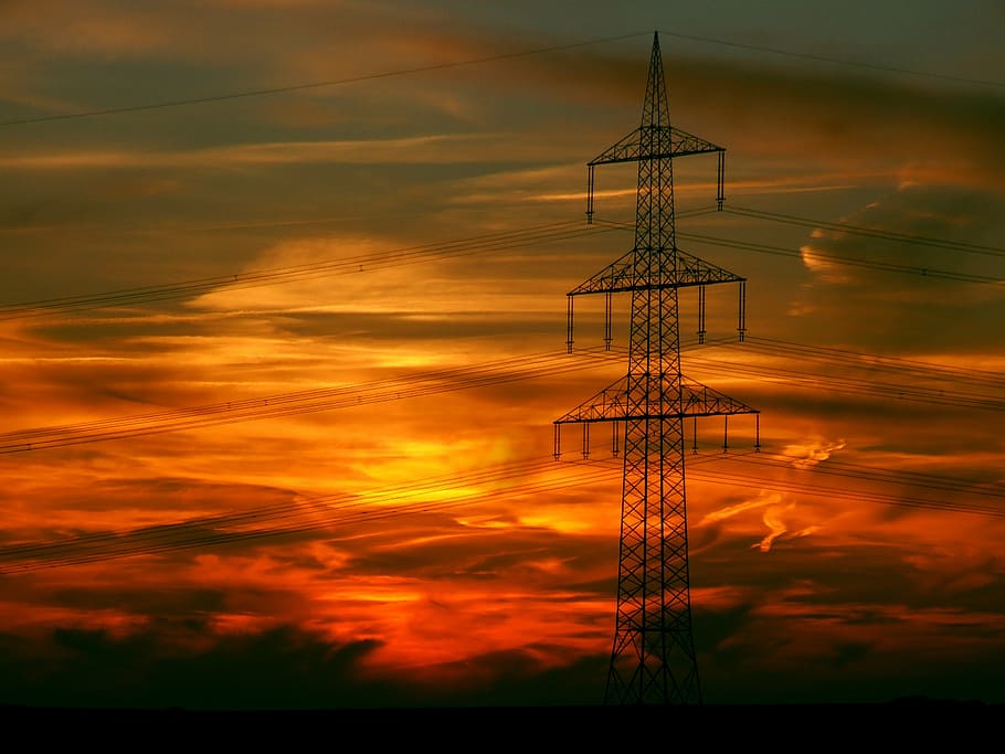 gray transmission post under orange sky, sunset, afterglow HD wallpaper