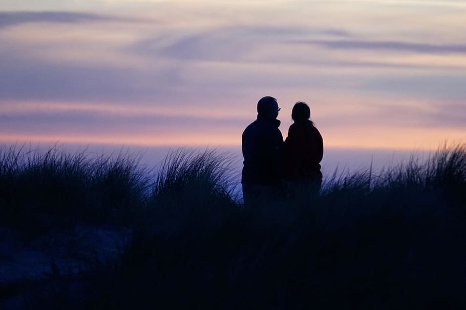 silhouette of two person on grass field, Sunset, Romance, Clouds HD wallpaper