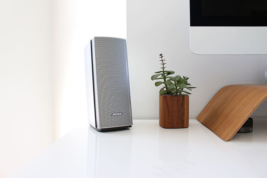 gray speaker on table near brown wooden pto, gray multimedia speaker on white surface, HD wallpaper