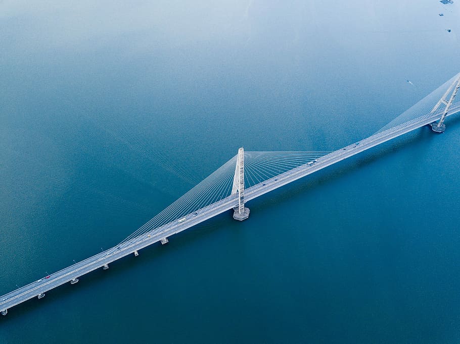 gray concrete bridge on body of water in aerial photography, aerial photography of cable bridge HD wallpaper