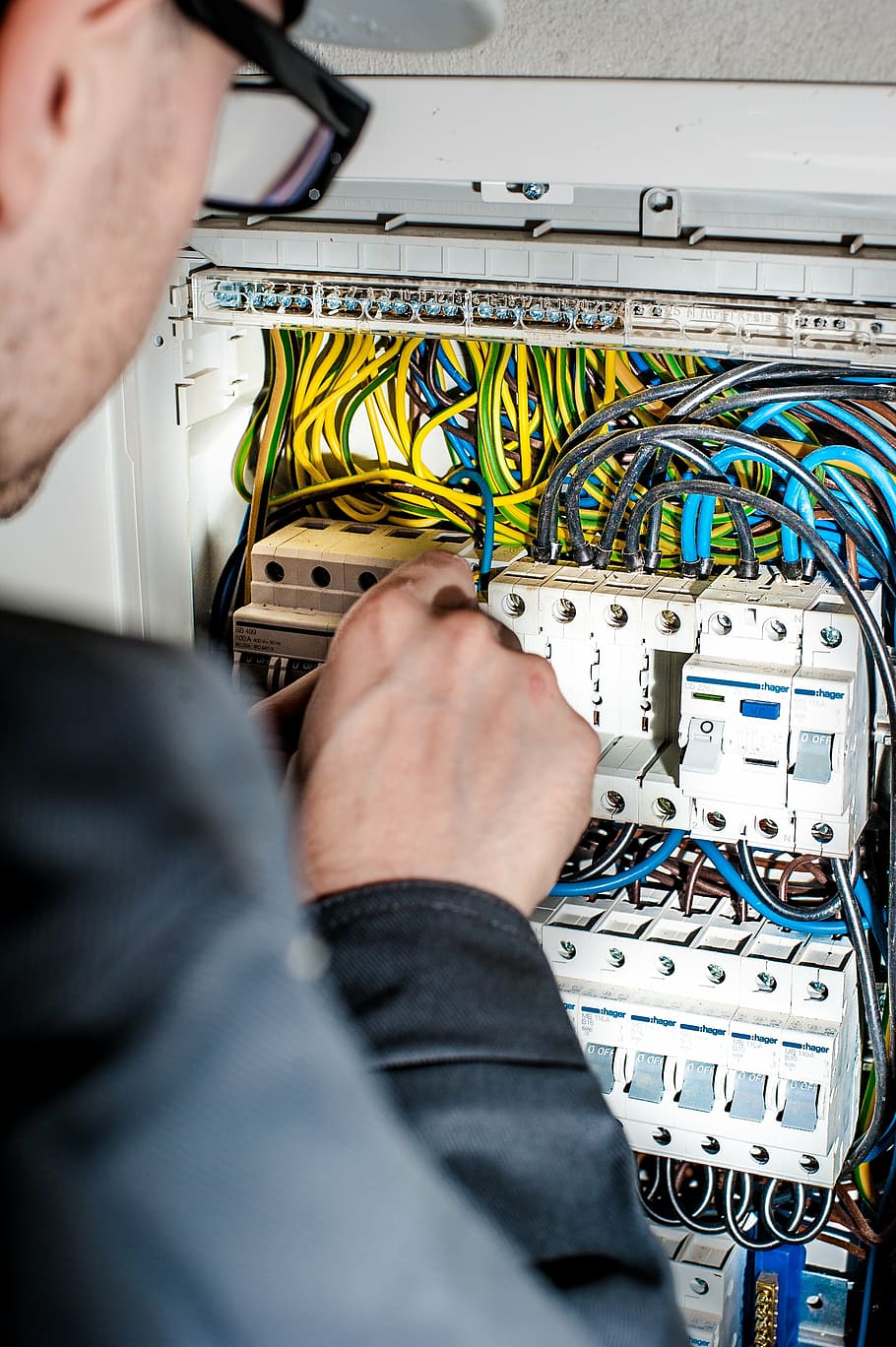 men fixing circuit board in control board, electrician, electricity
