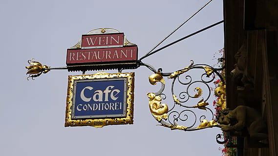 Wein Restaurant Cafe Conditorei signage during daytime, shield HD wallpaper