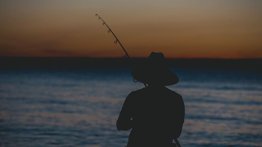 fishing shadows, silhouette of person fishing on body of water at golden hour HD wallpaper