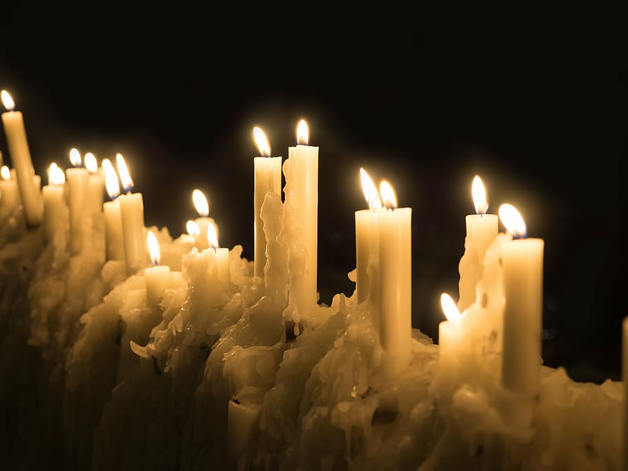 closeup photo of stick candles burning on black background HD wallpaper