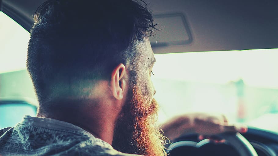 close up photography of man inside car, bearded man driving a car HD wallpaper