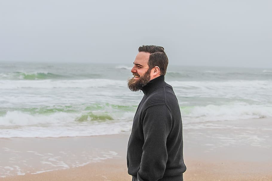 Man in Black Turtle-neck Jacket Standing on Shore, beach, beard
