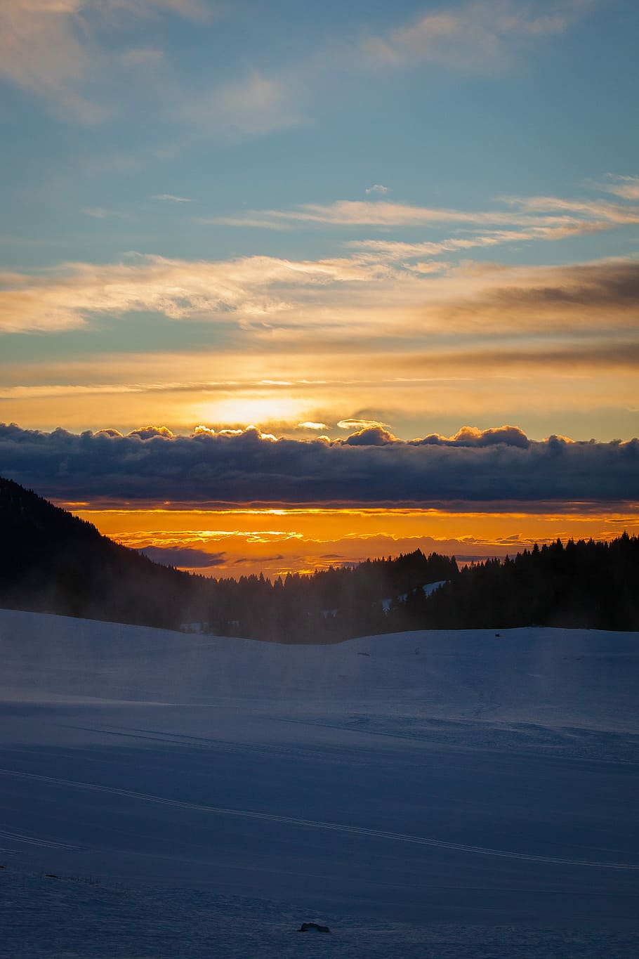 snow covered ground under sunset sky, aerial view photography of snowy mountain HD wallpaper