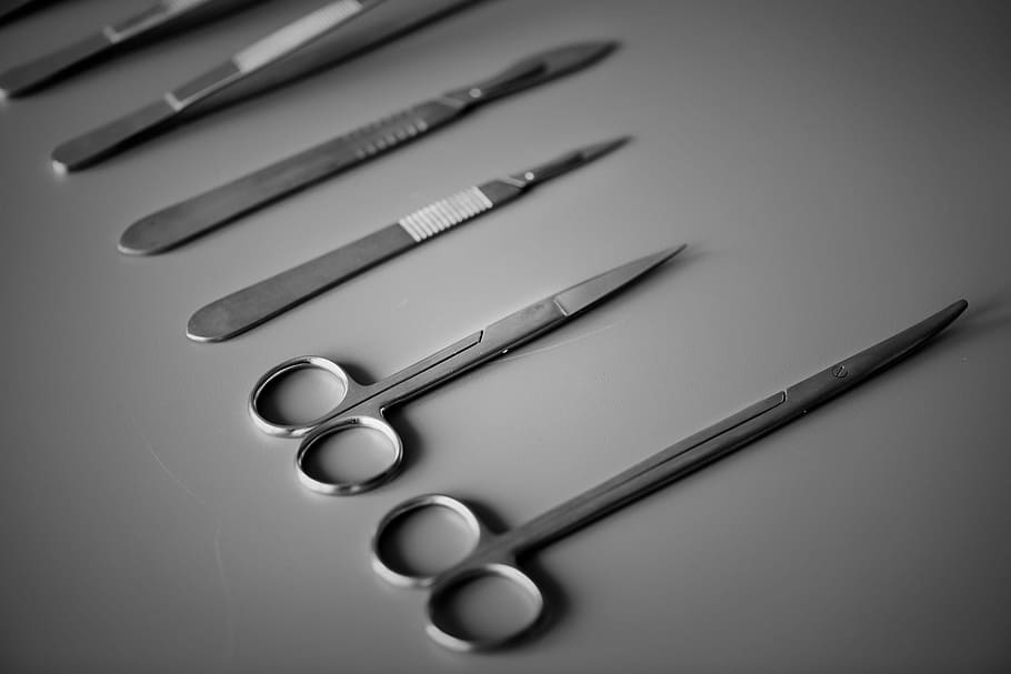 assorted handheld tools on desk, steel, black and white, bw, care