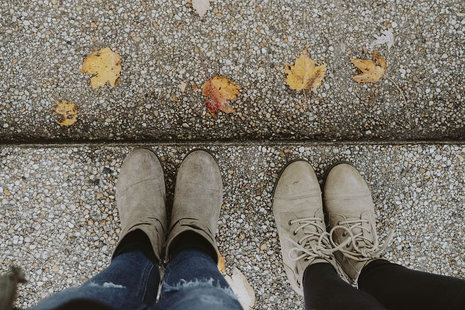 two pairs of brown leather Chukka boots and booties, two person wearing gray leather boots, HD wallpaper