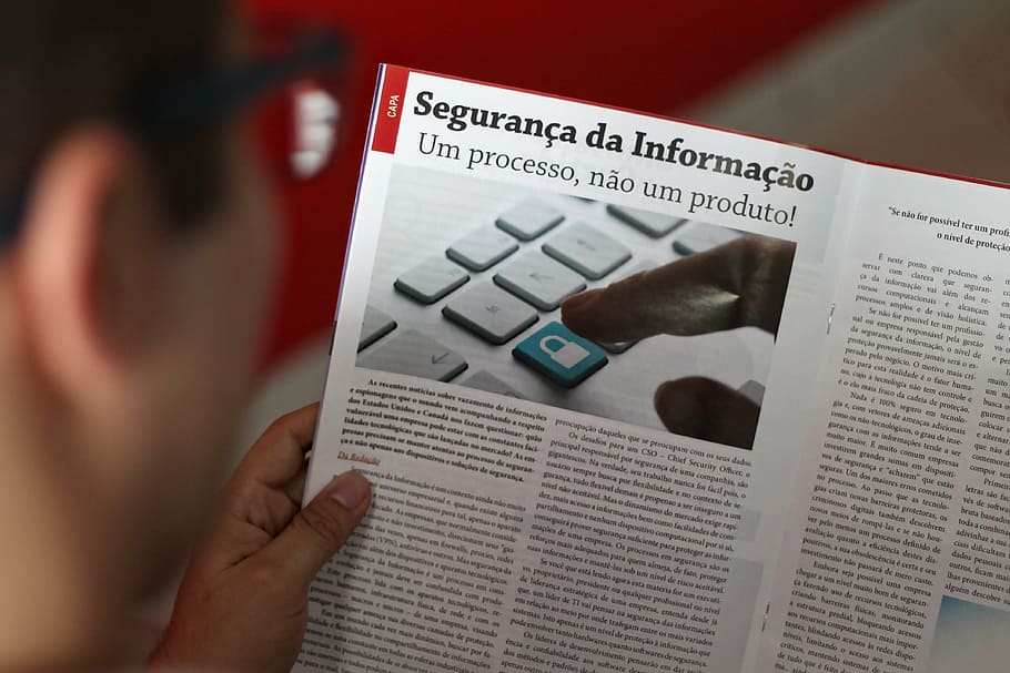 person holding book, reading, man reading, magazine, information security HD wallpaper