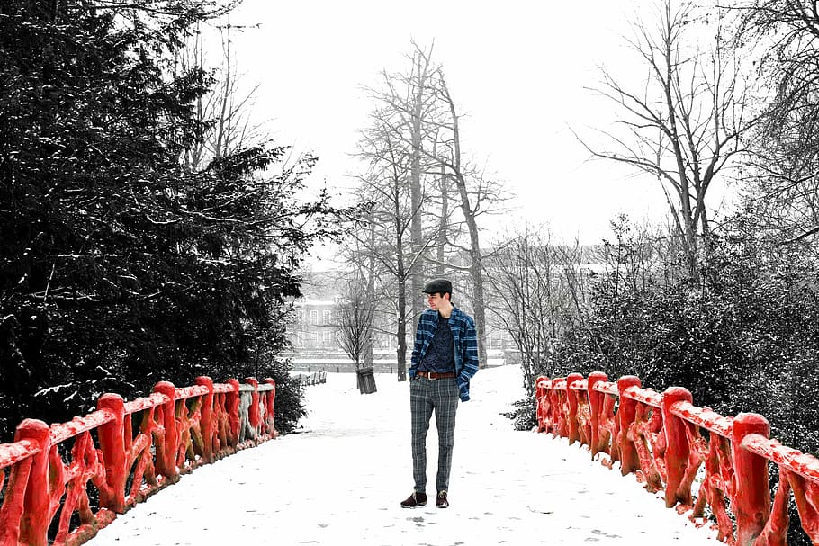 man standing in red bridge, man wearing black pants standing on bridge HD wallpaper