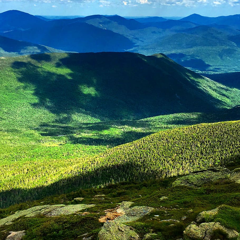 green grass mountain, aerial view photo of mountains under blue sky during daytime HD wallpaper
