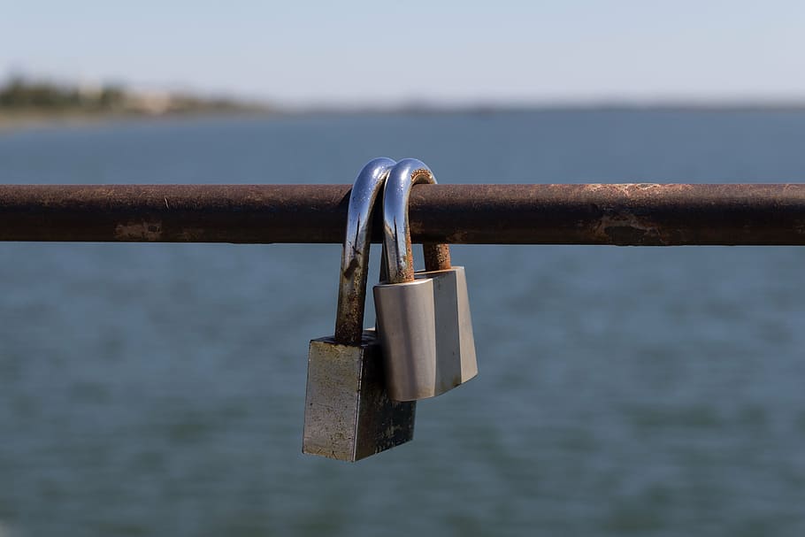 padlocks, commitment, link, promise, metal, water, focus on foreground HD wallpaper