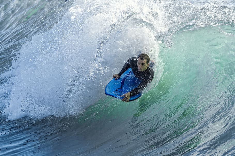 Laying surfer, man surfing on sea waves at daytime, water, ocean, HD wallpaper