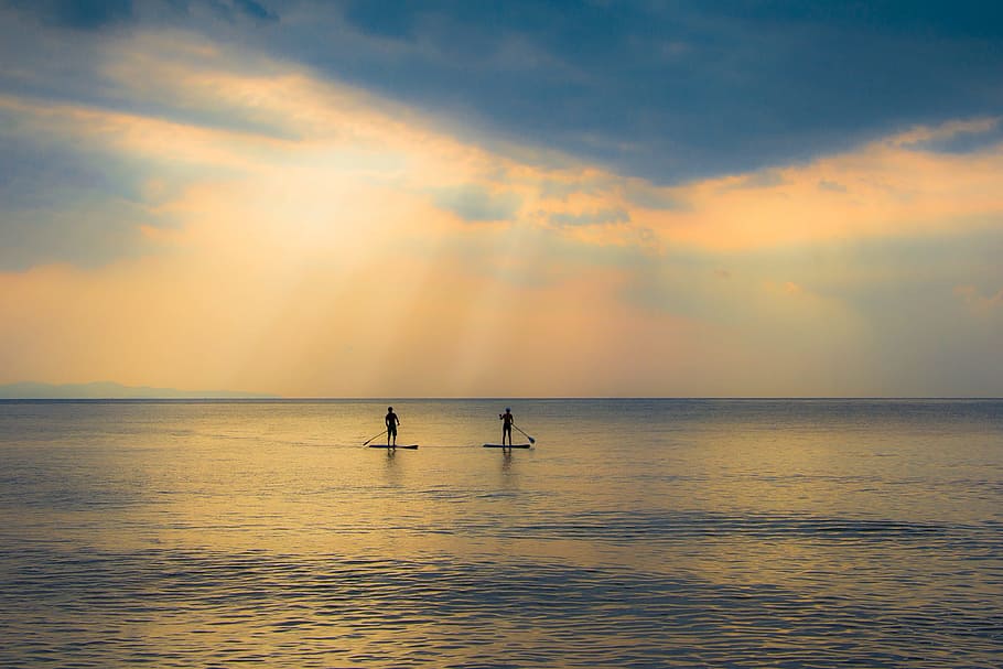 two person sailing on body of water during daytime, sunset HD wallpaper