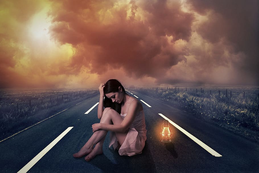 woman sitting in the middle of the road beside lamp, sunset, dusk, HD wallpaper