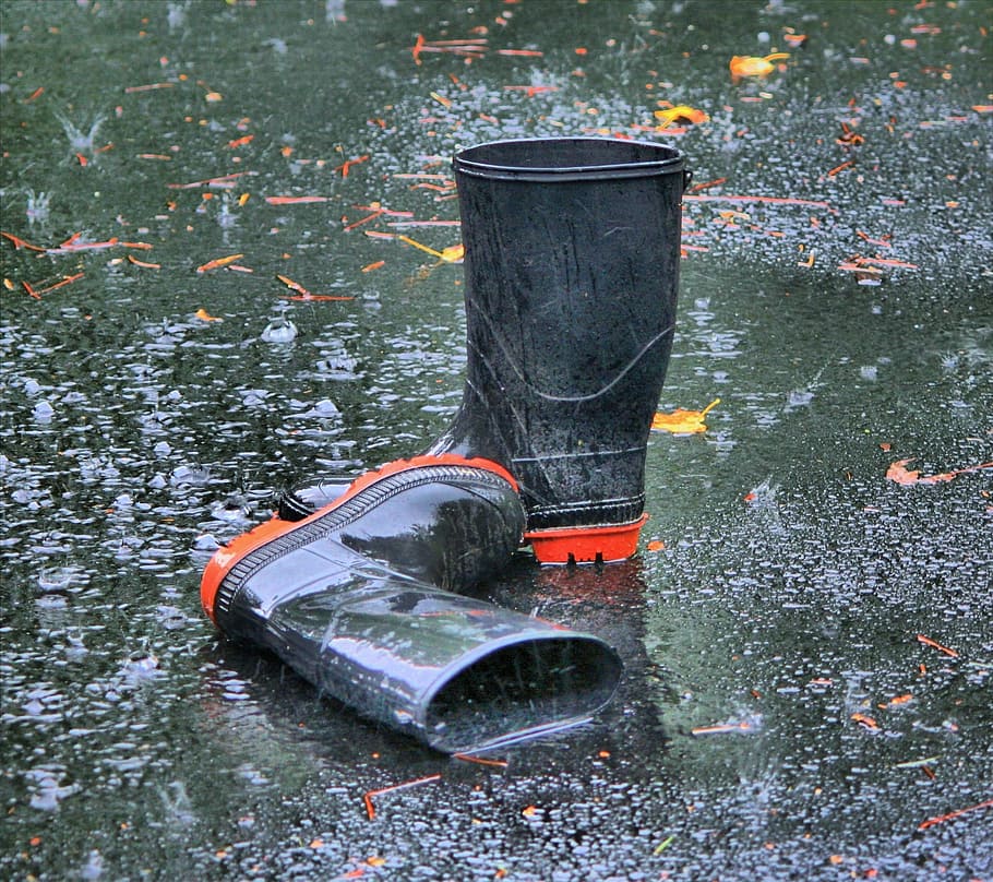 photo of black rain boots, rubber, galoshes, waders, footwear