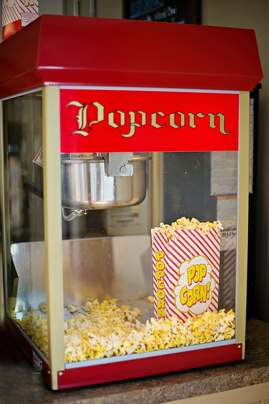 Popcorn maker filled with popcorn, popcorn machine, old-fashioned HD wallpaper