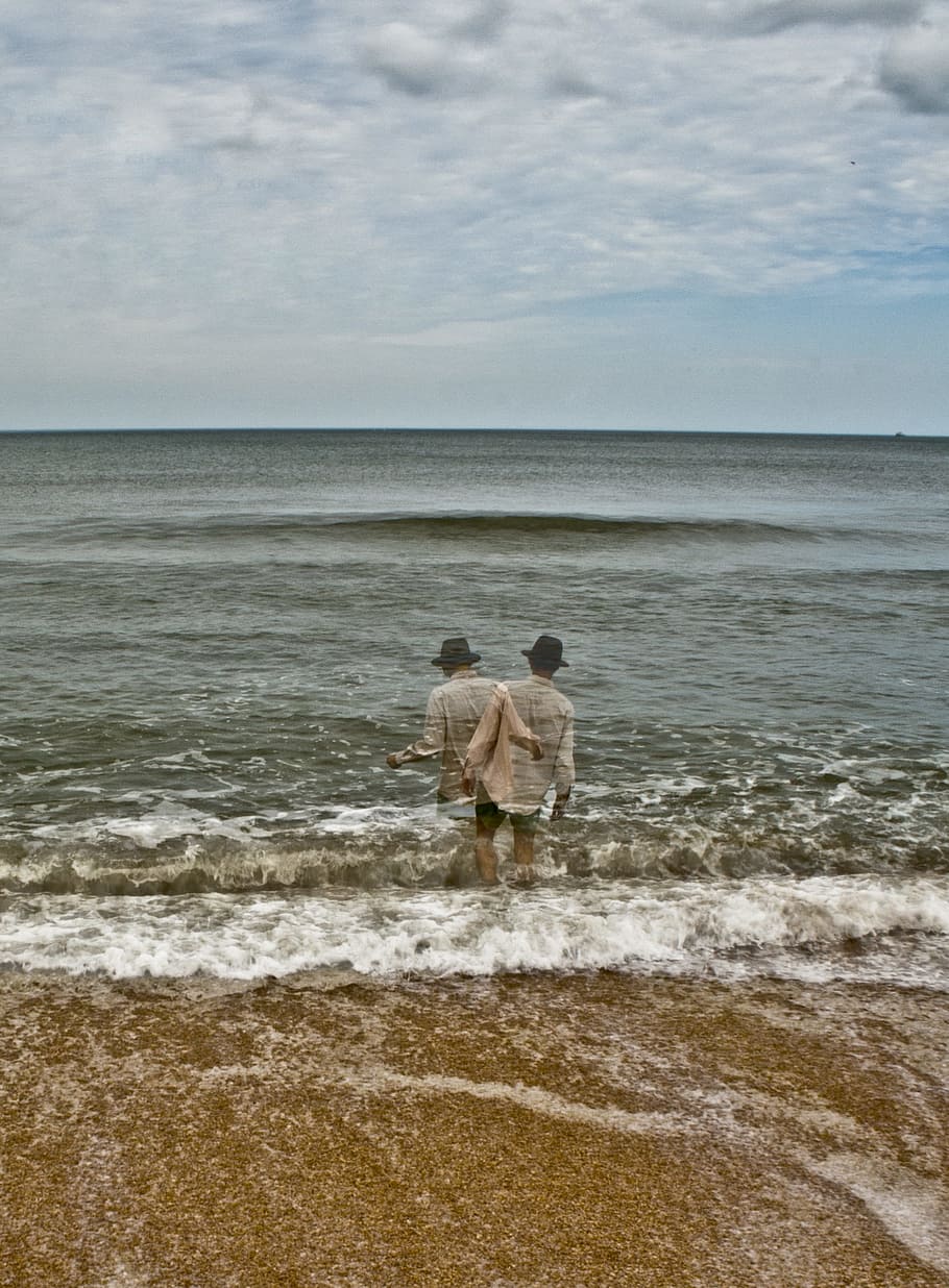 man in ocean, surrealism photograph of man walking towards sea HD wallpaper