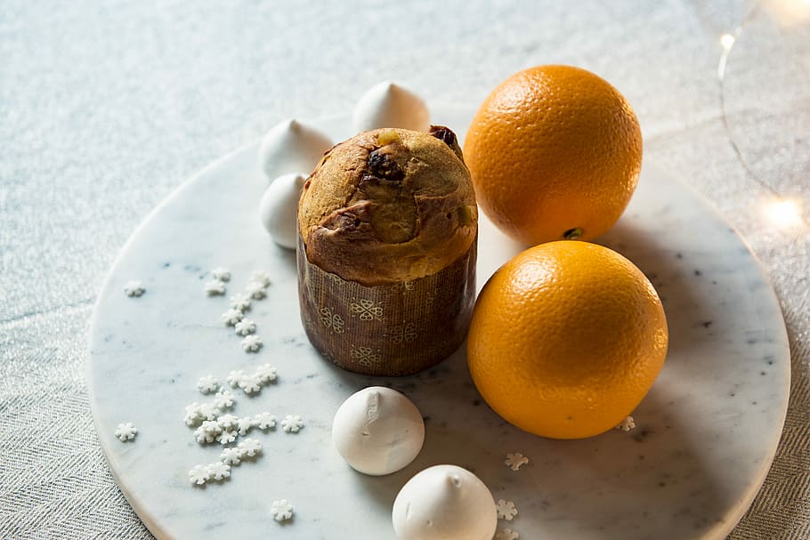 two orange fruits on white plate, muffin with orange fruit on table HD wallpaper