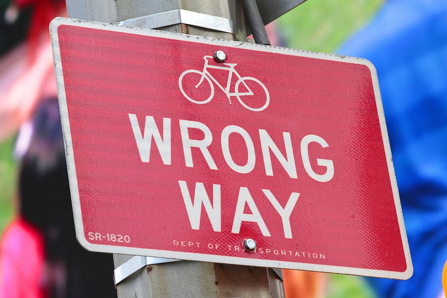 Wrong Way signage, no, confused, transit sign, red, bicycle, symbol