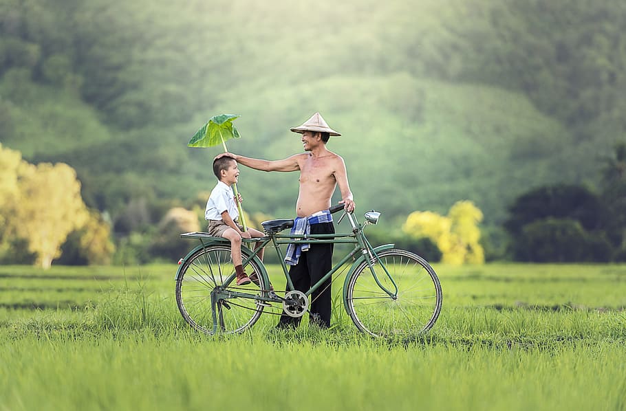 man wearing black pants standing beside green city bicycle with boy wearing white button-up shirt, HD wallpaper