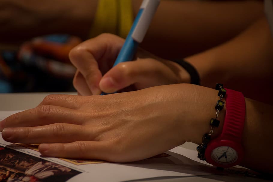 person writing using ball point pen, hands, girl, beautiful girl