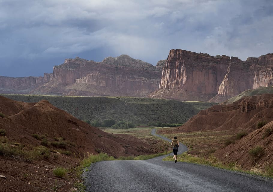 man running in road near mountain at daytime, jogger, landscape HD wallpaper