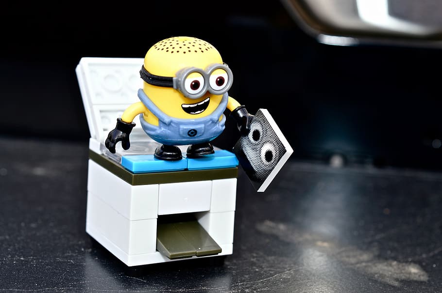 Bob the minion toy on gas range toy in close-up photography, photocopier